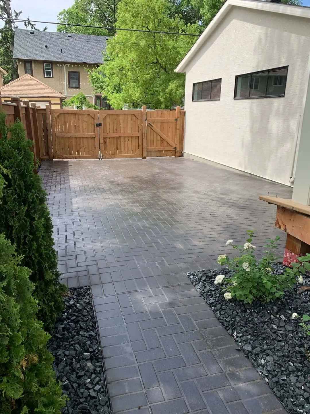 Flagstone path with planting beds in black decorative rock